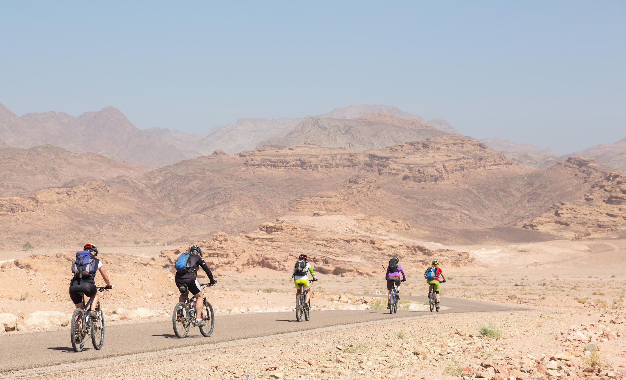 A group of cyclists on the road in Jordan. Photo: Getty.