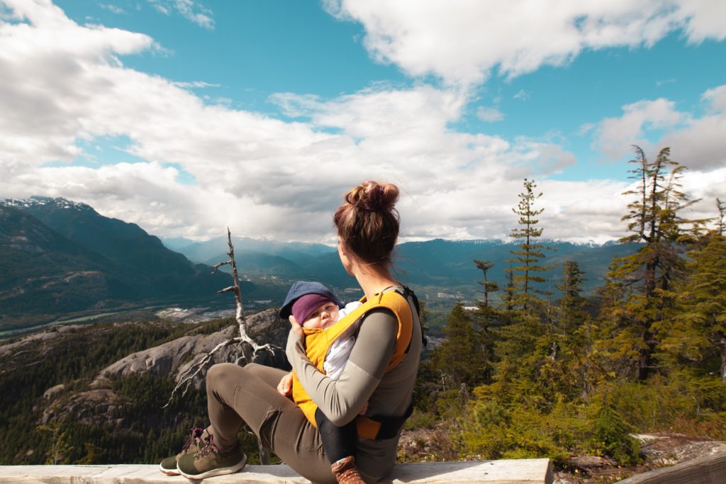 woman standing with baby